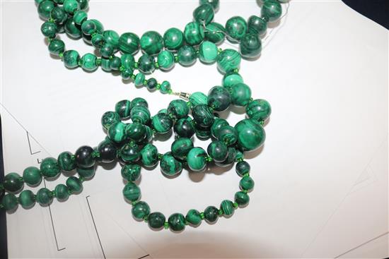 Three malachite bead necklaces and two amberoid bead necklaces